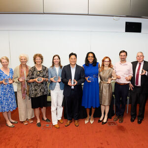 Faculty members hold their awards
