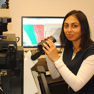 Yamuna Krishnan at microscope